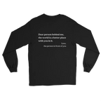 A black long-sleeve t-shirt with white printed text on the back "dear person behind me, the world is a better place with you in it. Love, the person in front of you", displayed against a solid white background.